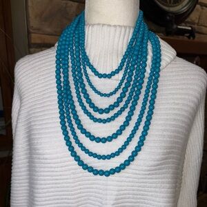 GORGEOUS VINTAGE LOOKING MULTI STRANDS OF TURQUOISE BLUE BEADS.